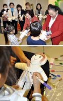 　［上］子どもたちにキワニスドールを贈る徳島キワニスクラブの会員［下］キワニスドールに顔や服を描く子ども＝いずれも徳島大病院の小児病棟