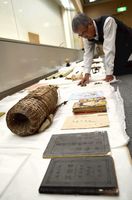 東日本大震災の津波被害に遭った後、修復された資料を整理する学芸員＝徳島市の県立博物館