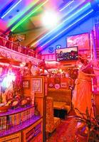 バレンシーアの店内。所狭しと並ぶオブジェがネオンの妖しい光に照らされている=徳島市八万町大野